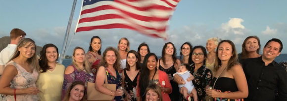Group of Wives and Significant Others in front of American Flag